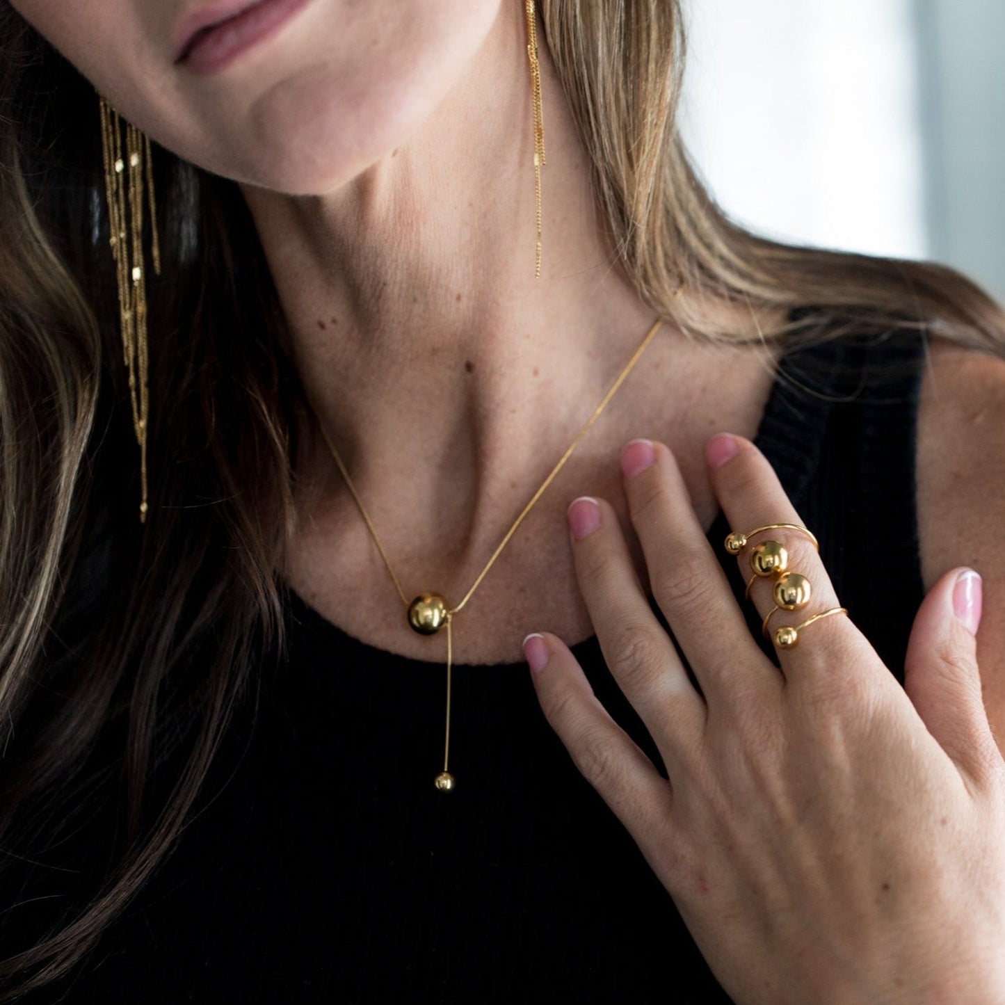 cascading gold bead necklace front view