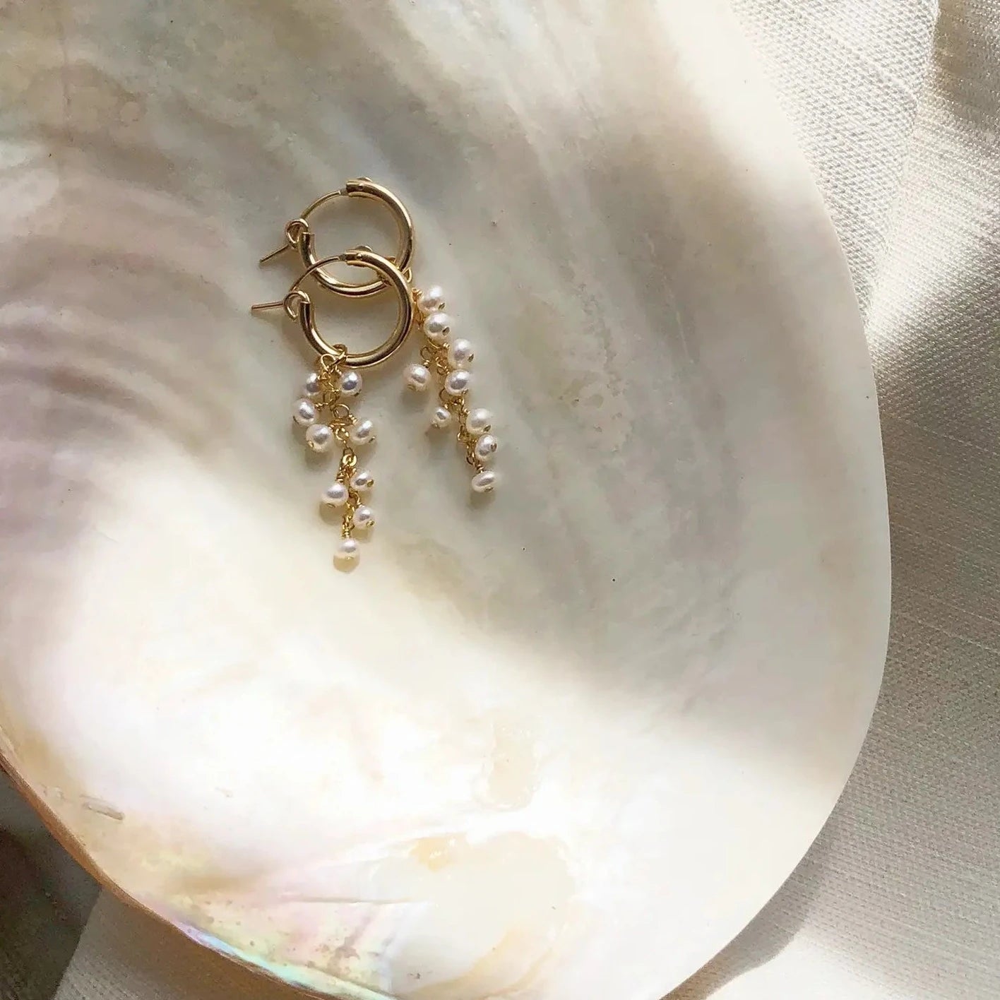 Gold filled pearl cluster earrings on shell