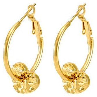 gold hammered heart on a gold hoop earring 