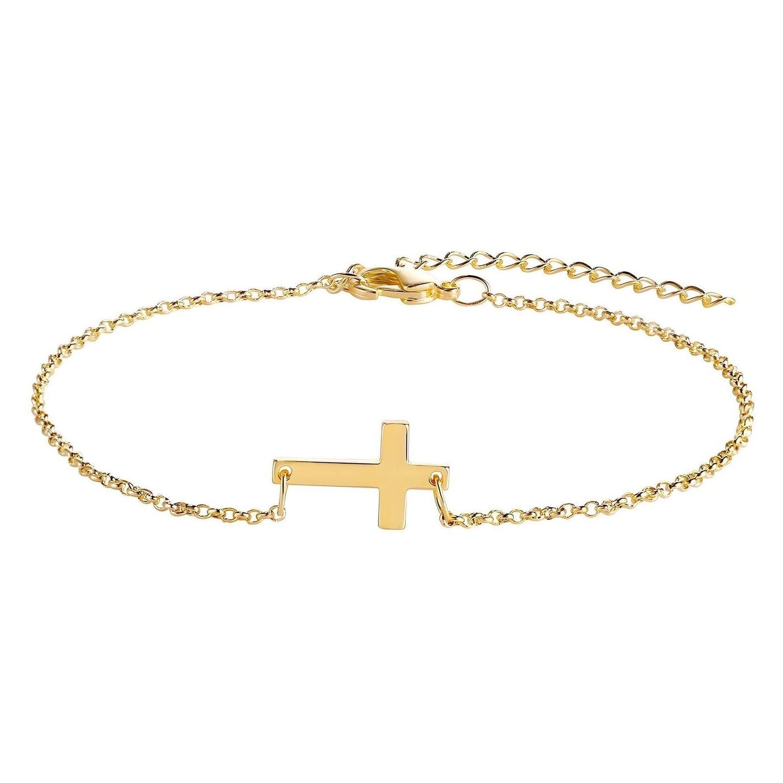 Gold necklace with cross on table 