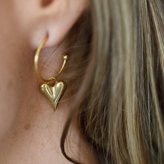 dangling heart earrings left ear